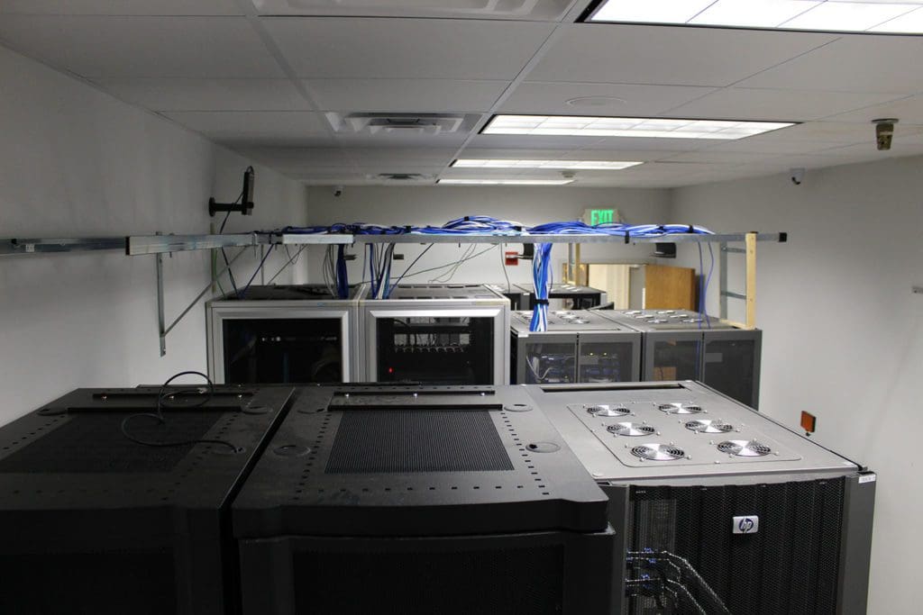 View of the top of a server room with the cabling routed on a cable ladder used for Microsoft Cloud Solution Providers