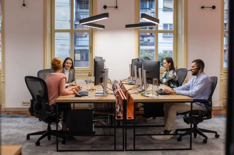 Team working on computers in a smart classroom