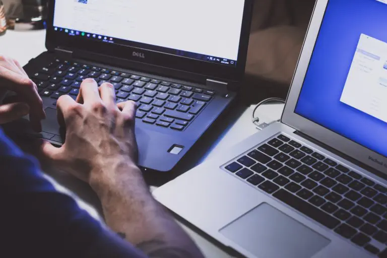 Man working on laptop computers
