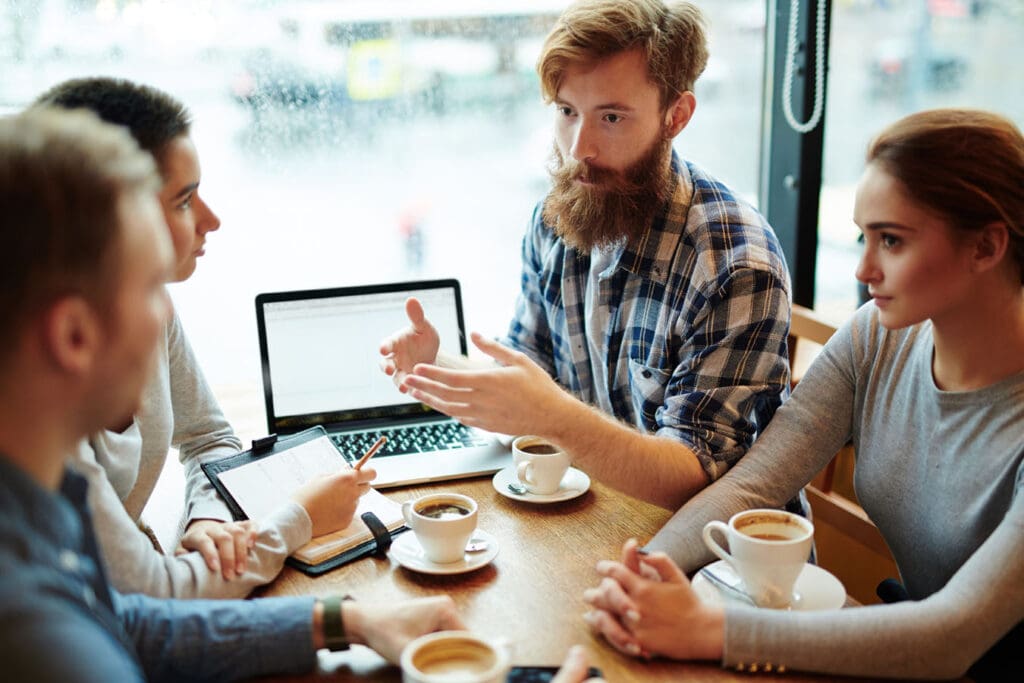 Business-Colleagues-Meet-at-a-Coffee-Shop-for-a-midday-meeting