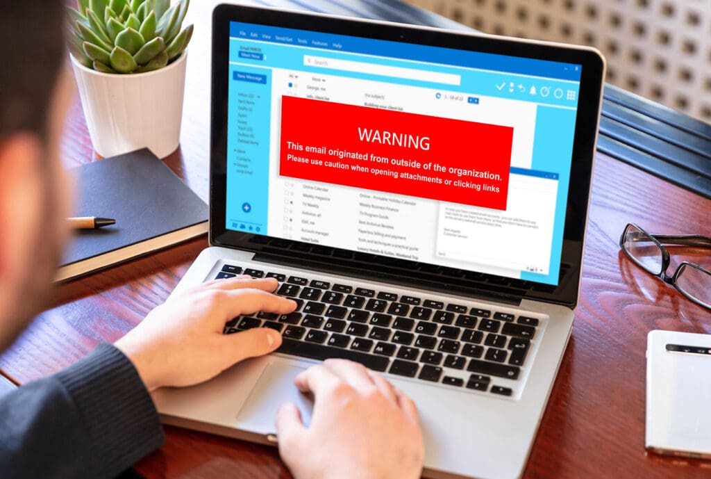 Email service warning employee of potential phishing scam caught by security measures