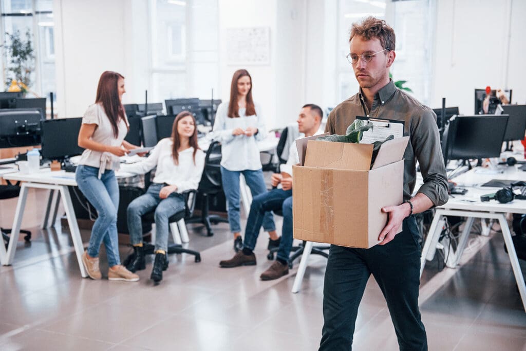 Employee-walking-out-of-office-after-resigning