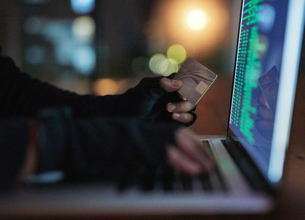 Hidden Figure entering credit card information into ransomware software
