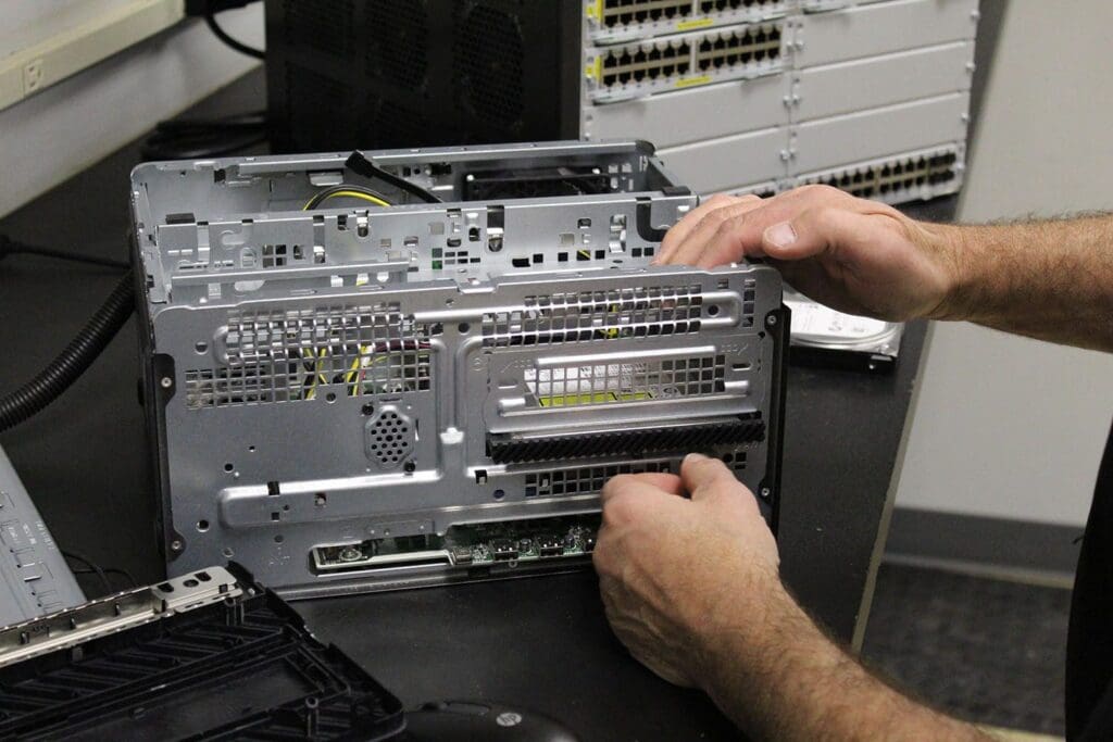 Technician working on a computer repair or upgrade