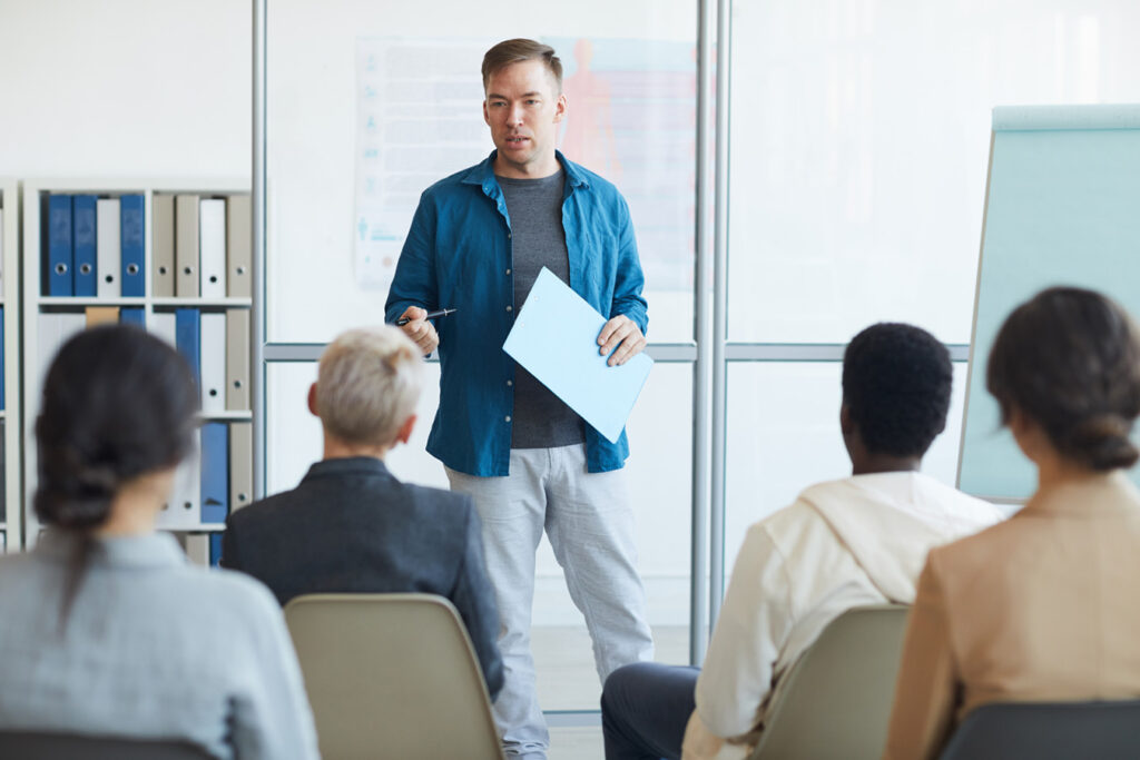 Man-giving-a-cybersecurity-course-to-employees-to-keep-company-data-secure