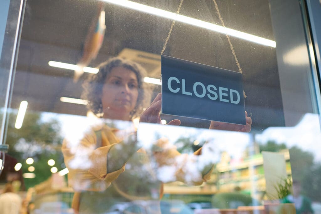 Small-Business-employee-closing-her-doors-due-to-data-breach-issues