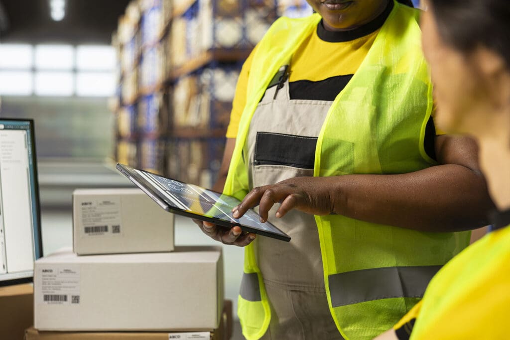 Staff-in-shipping-cneter-using-technology-to-complete-their-job
