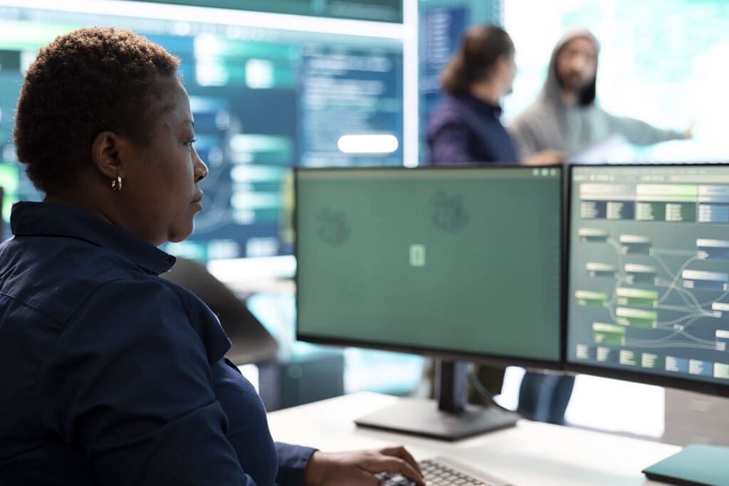 Woman-using-her-computer-at-work-to-complete-tasks-efficiently
