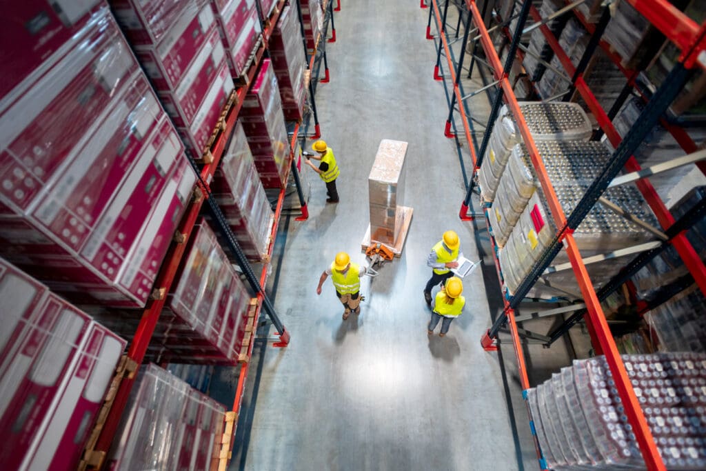 Workers-scanning-and-moving-supplies-around-a-warehouse