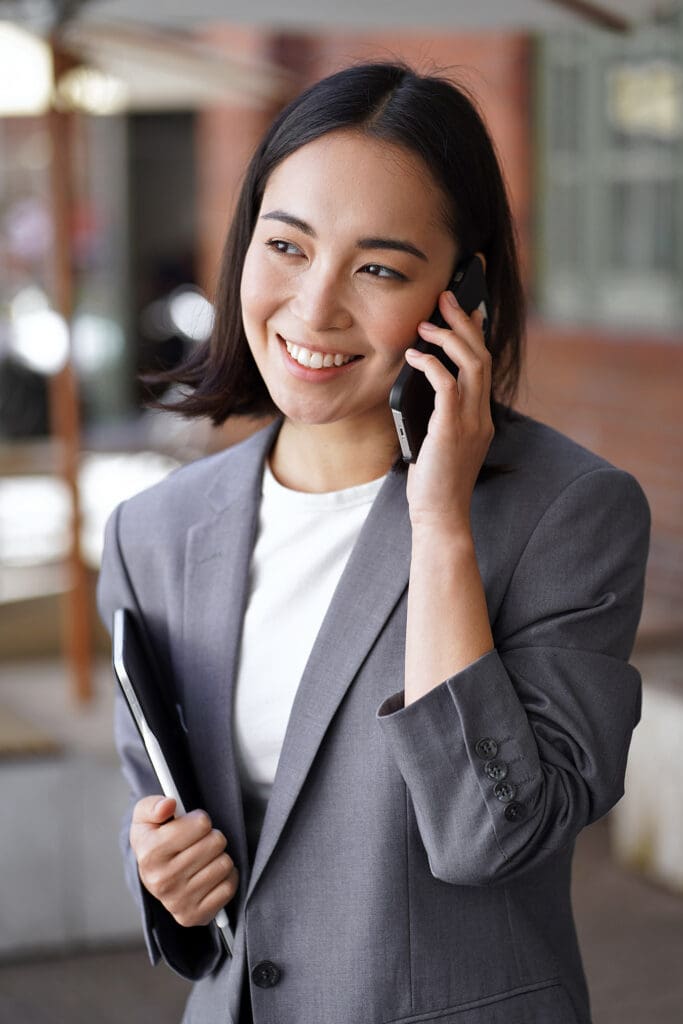 businesswoman answers her cellphone