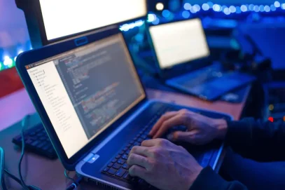 programmer typing code to update cybersecurity programmer typing code to update cybersecurity